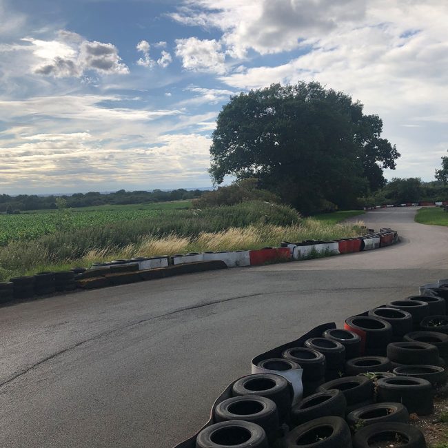 Outdoor karting track at Stretton Circuit is surrounded by rolling countryside